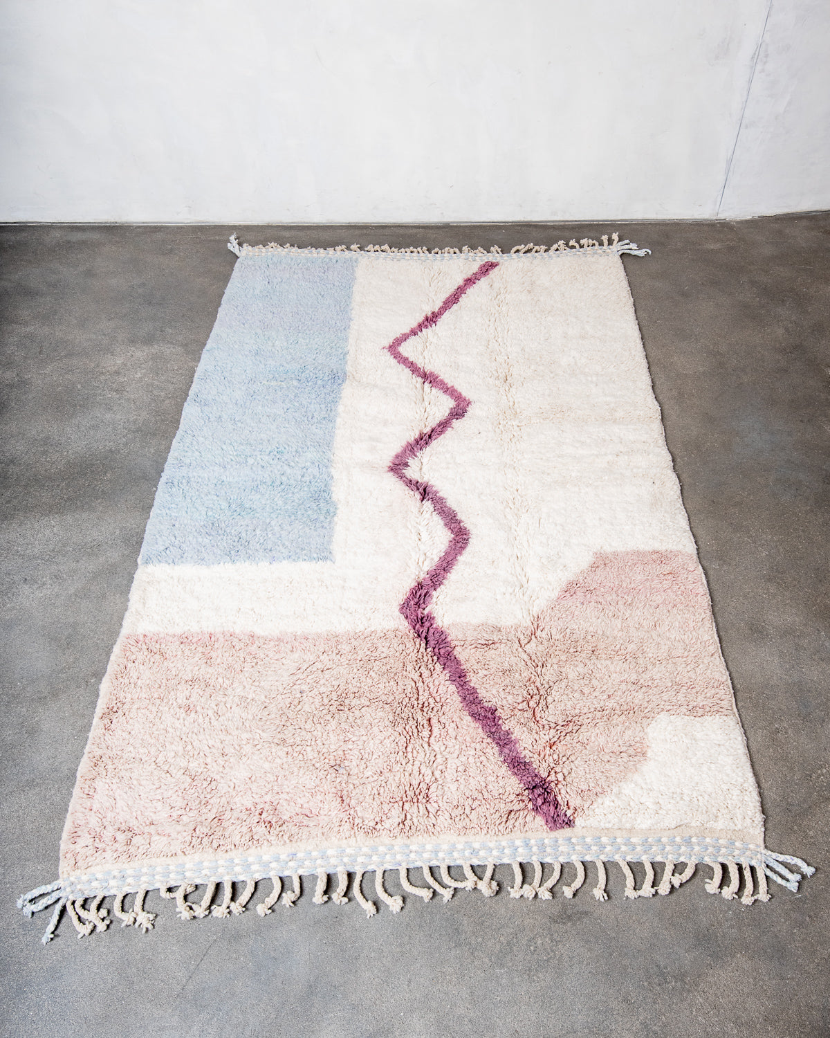 Modern, designer, handcrafted Berber rug from Morocco. Beniourain carpet with beautiful colours and patterns and fluffy wool texture.
